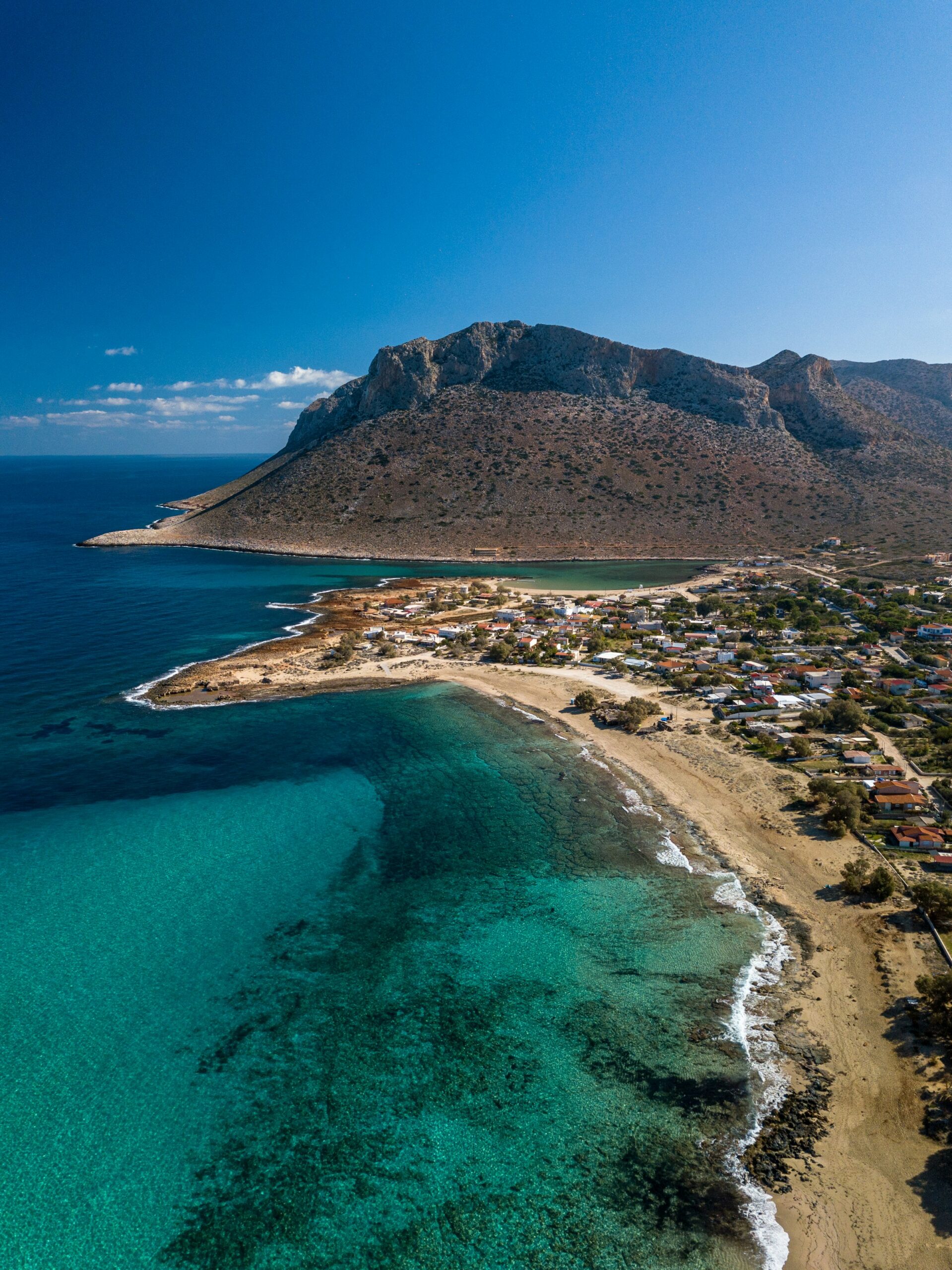Crete beach with mountain backdrop