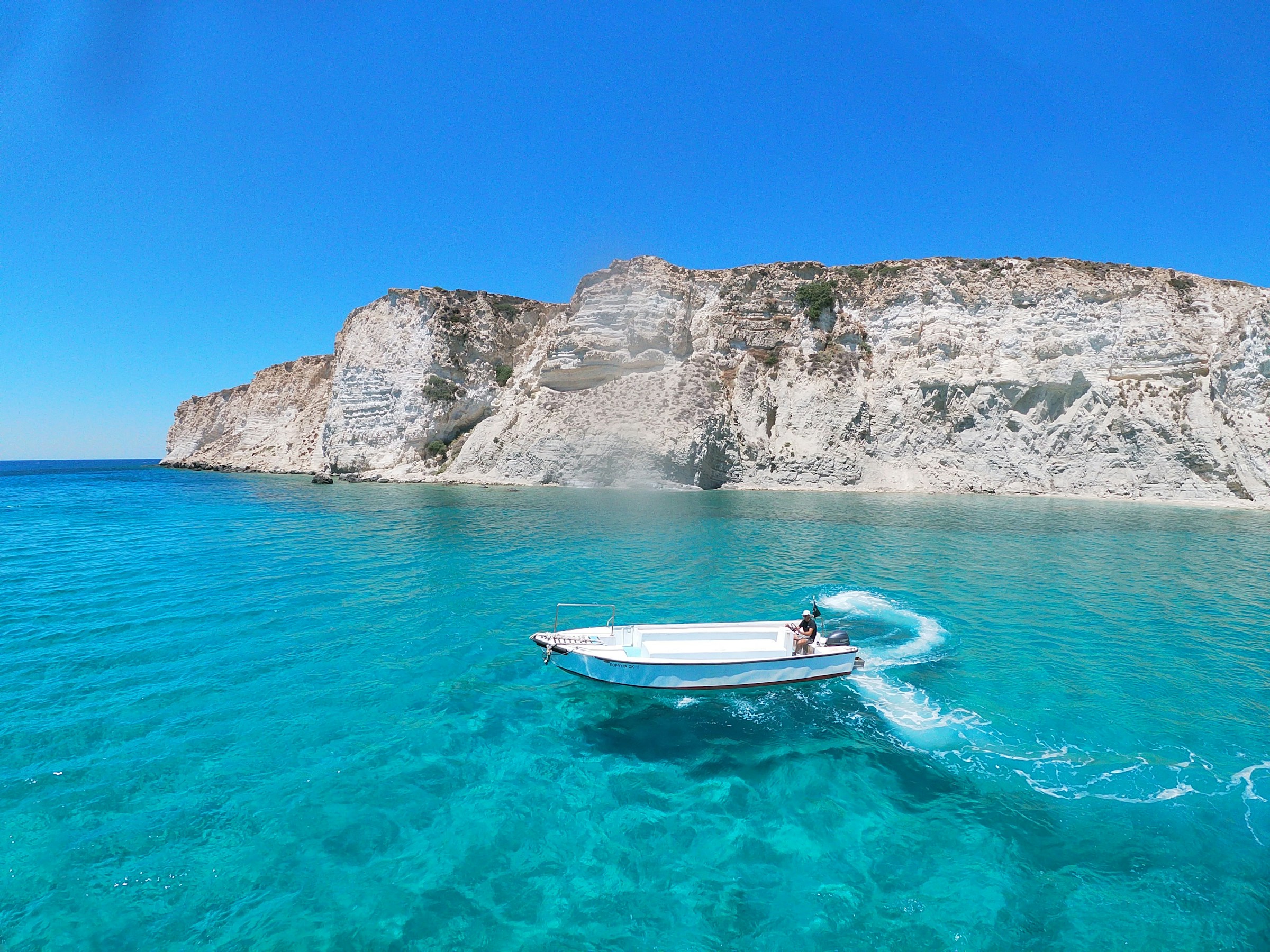 White and blue boat off the coast of Crete